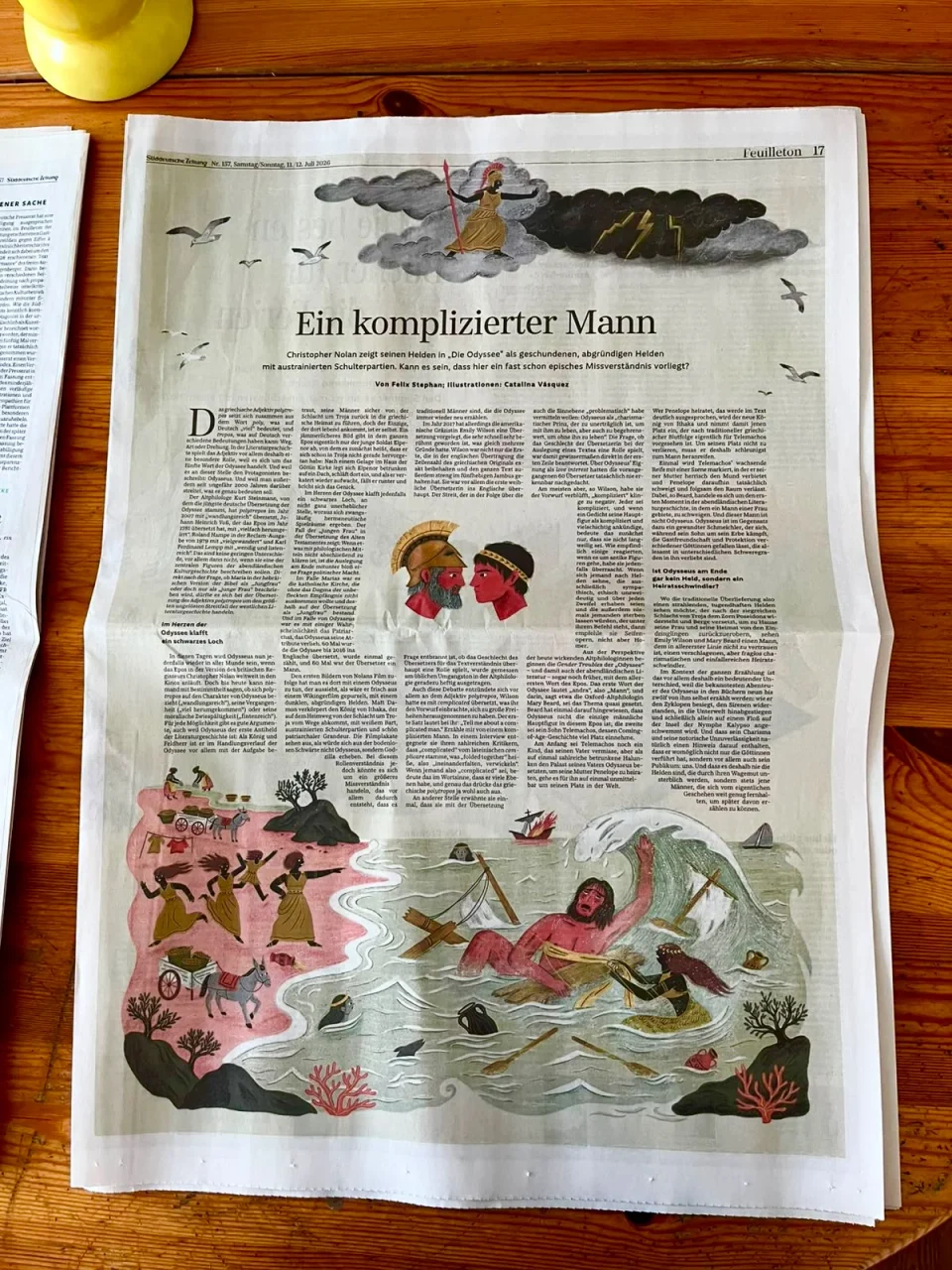 The printed newspaper on a table, open at the Odyssey essay