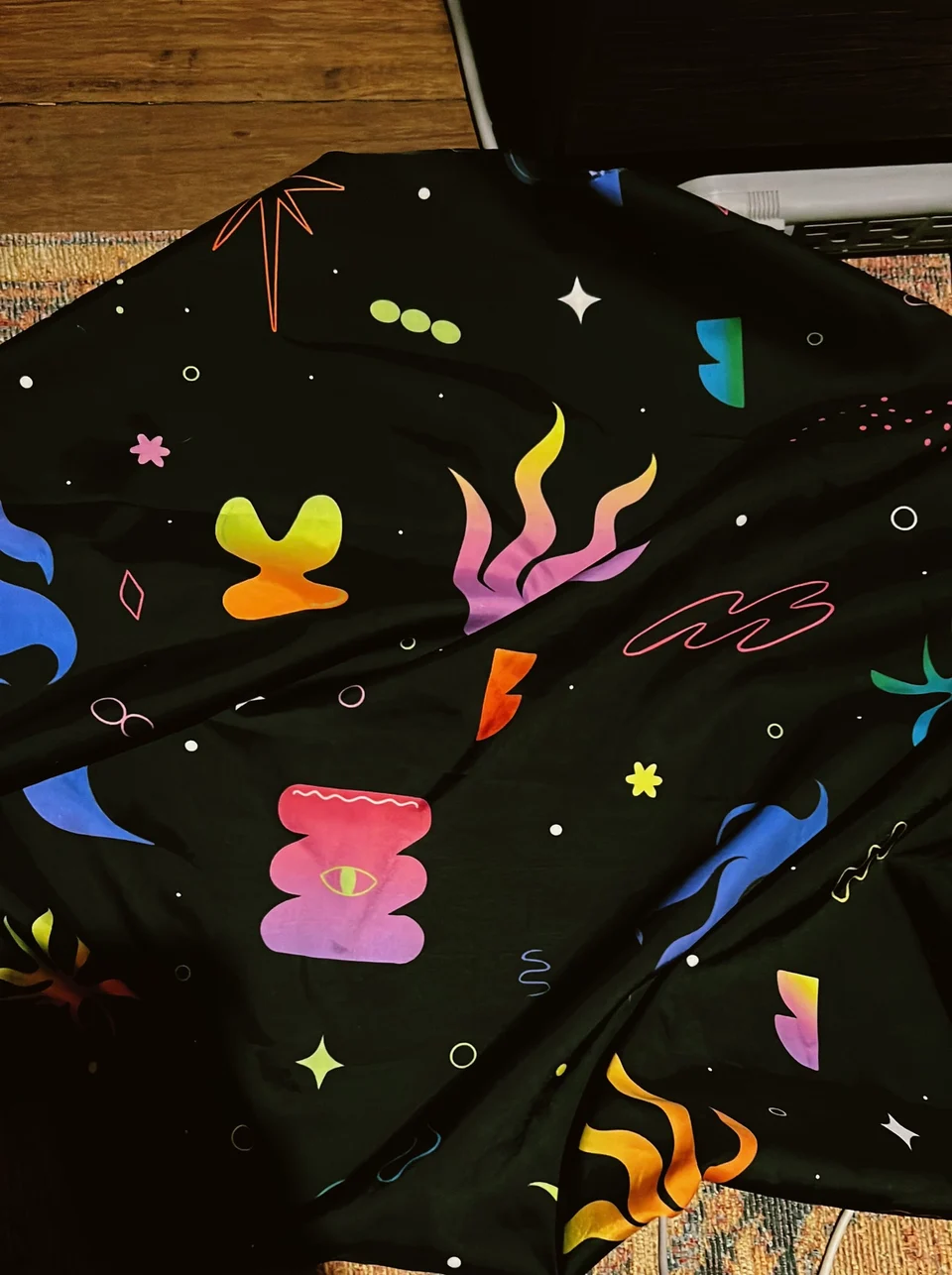 Close view of the printed kimono fabric and its illustrated characters
